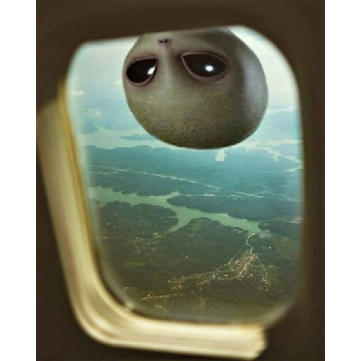 Figurinha: ET no avião
