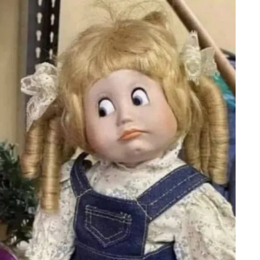Figurinha: Boneca com cara de espanto