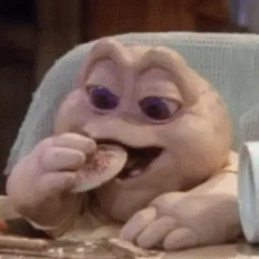 Figurinha: Bebê da Família Dinossauro comendo