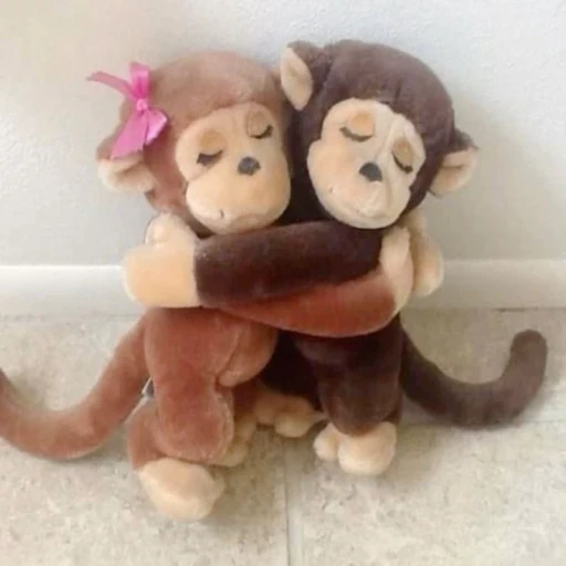 Figurinha: Macacos abraçados