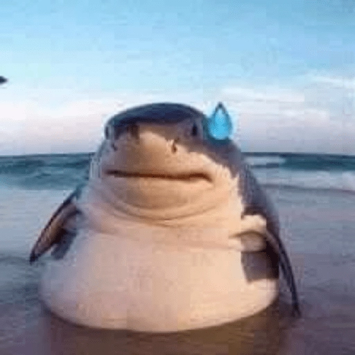 Figurinha: Tubarão triste na praia