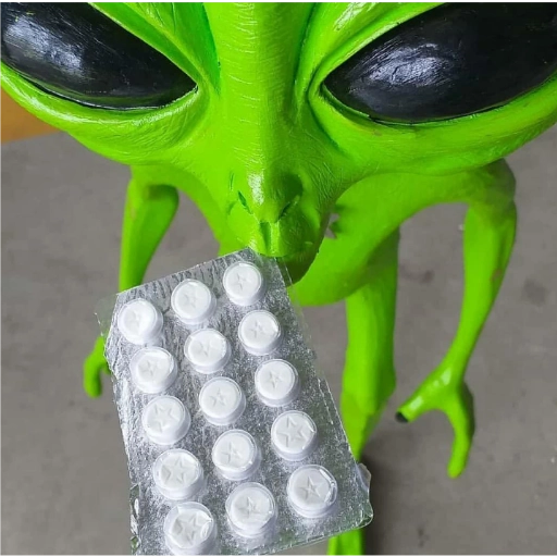 Figurinha: Alienígena com comprimidos