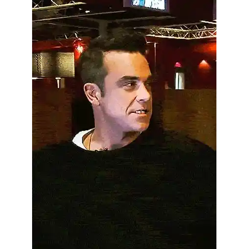 Figurinha: Robbie Williams reagindo