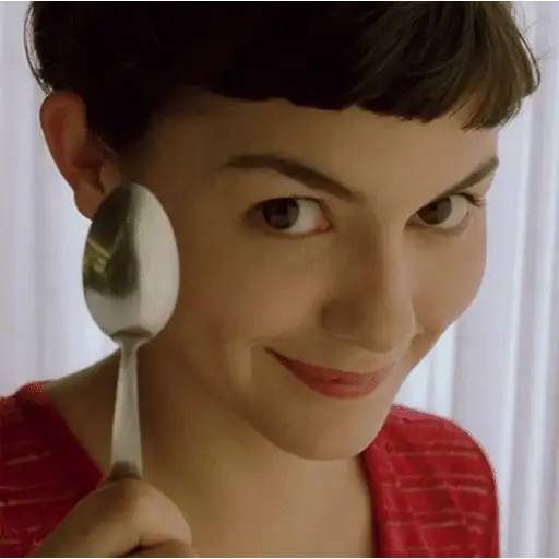 Figurinha: Amélie Poulain com uma colher