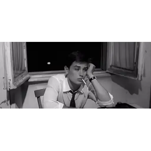 Figurinha: Alain Delon entediado