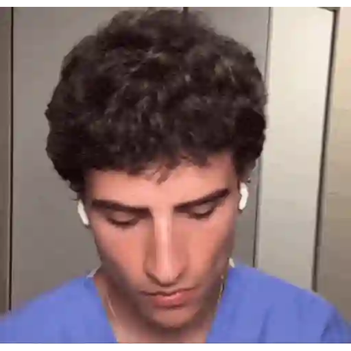 Figurinha: Jovem de scrub fazendo gesto ok