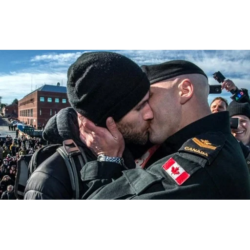 Figurinha: Casal Canadense em Reencontro Emocionant