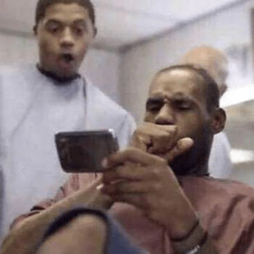 Figurinha: LeBron James olhando celular