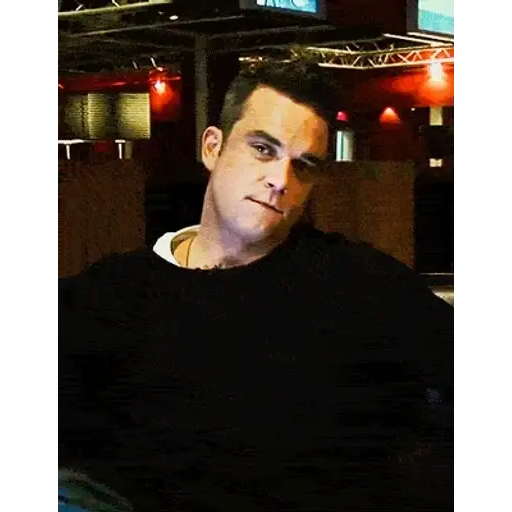 Figurinha: Robbie Williams sorrindo